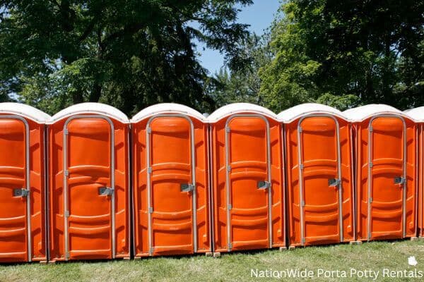 a lineup of clean and well-maintained portable loos for workers in Antwerp, OH