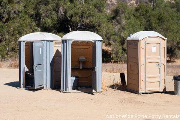 a clean row of portable restrooms for outdoor weddings or festivals in Antwerp, OH